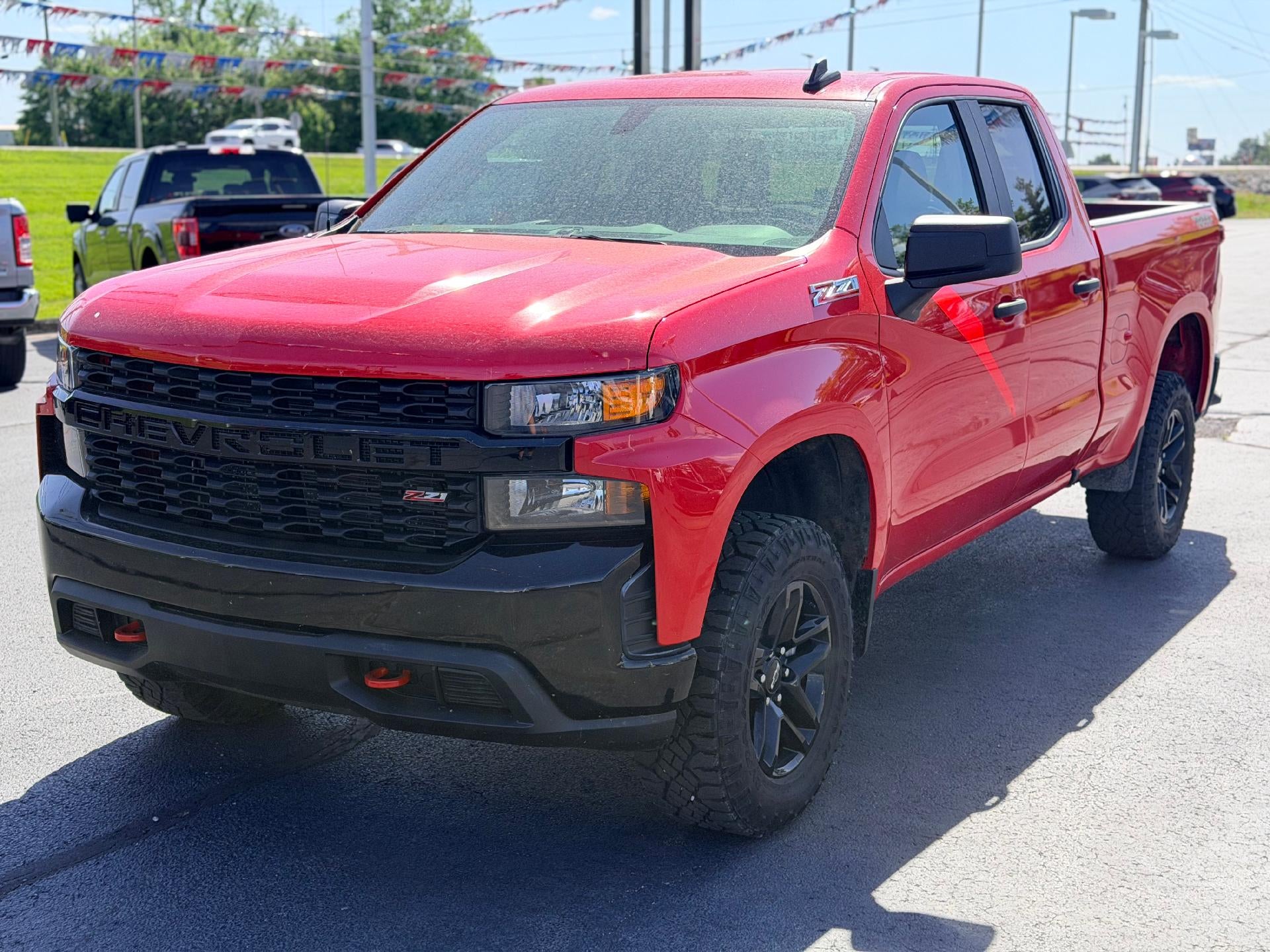 2019 Chevrolet Silverado 1500 Custom Trail Boss in Red Hot — front three-quarter view