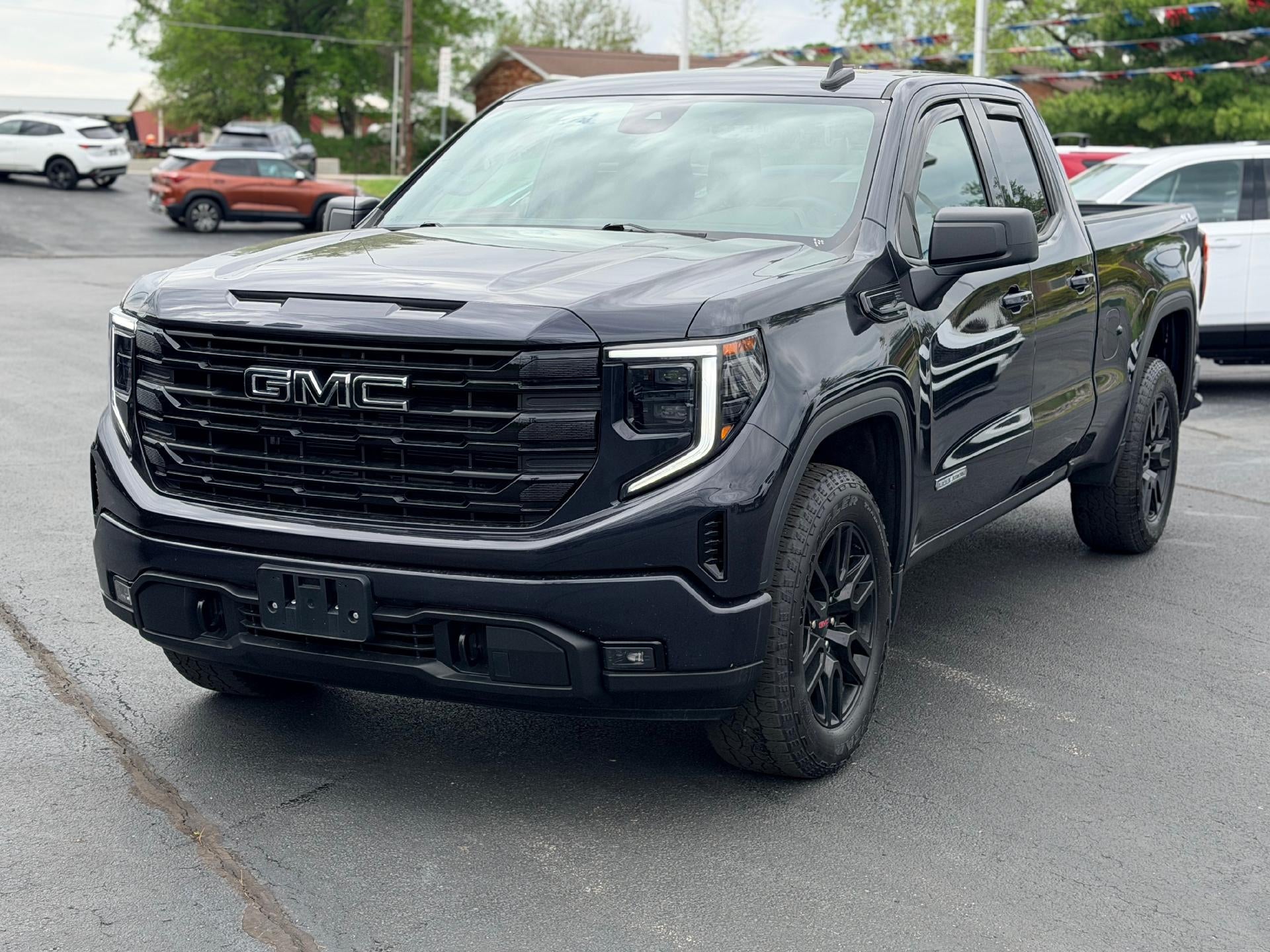 2023 GMC Sierra 1500 Elevation in Titanium Rush Metallic — front three-quarter view