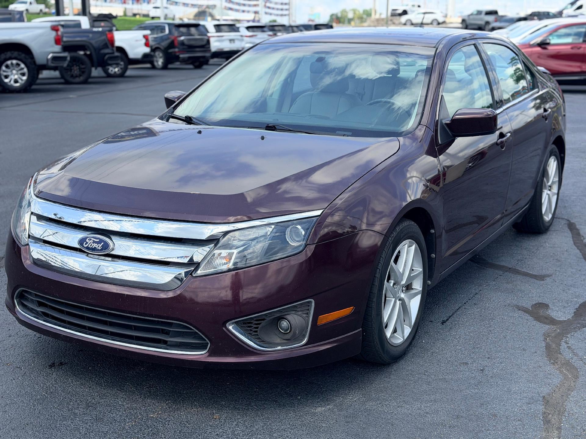 2011 Ford Fusion SEL in Maroon — front three-quarter view