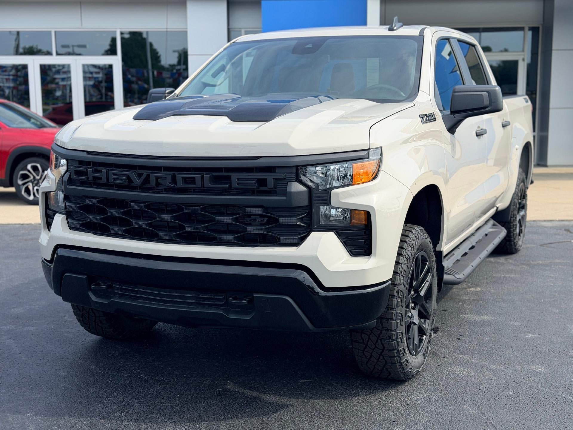 2026 Chevrolet Silverado 1500 Custom Trail Boss in White Sands — front three-quarter view