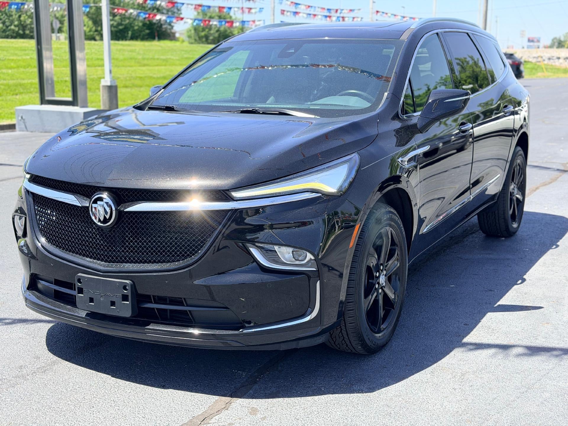 2023 Buick Enclave Essence in Ebony Twilight Metallic — front three-quarter view