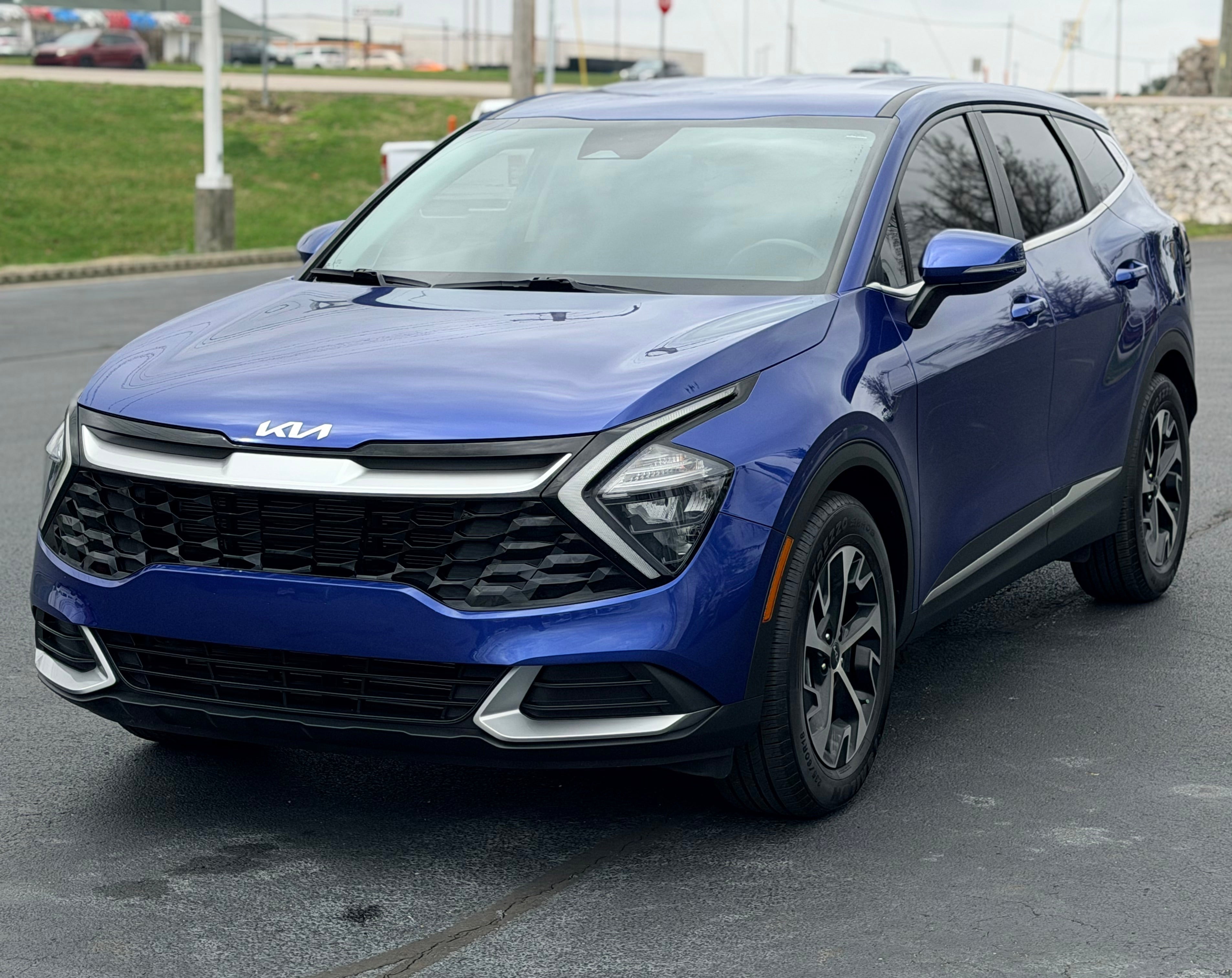 2023 Kia Sportage EX in Blue — front three-quarter view